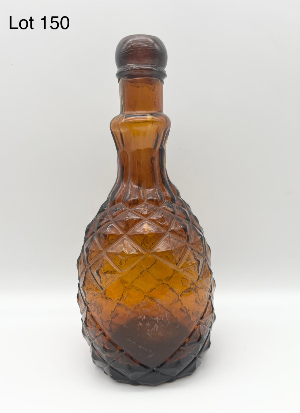Auction comp thumbnail for 19th Century Embossed Amber Glass Pineapple Bottle (Embassy Auctions International, Lot 150)