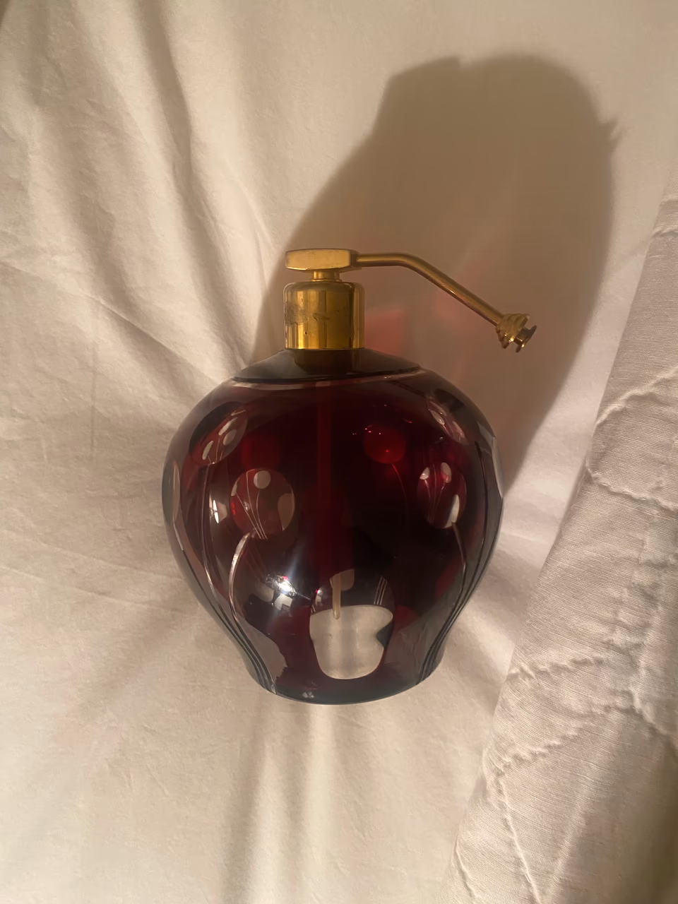 Art glass perfume atomizer photographed for small-object research