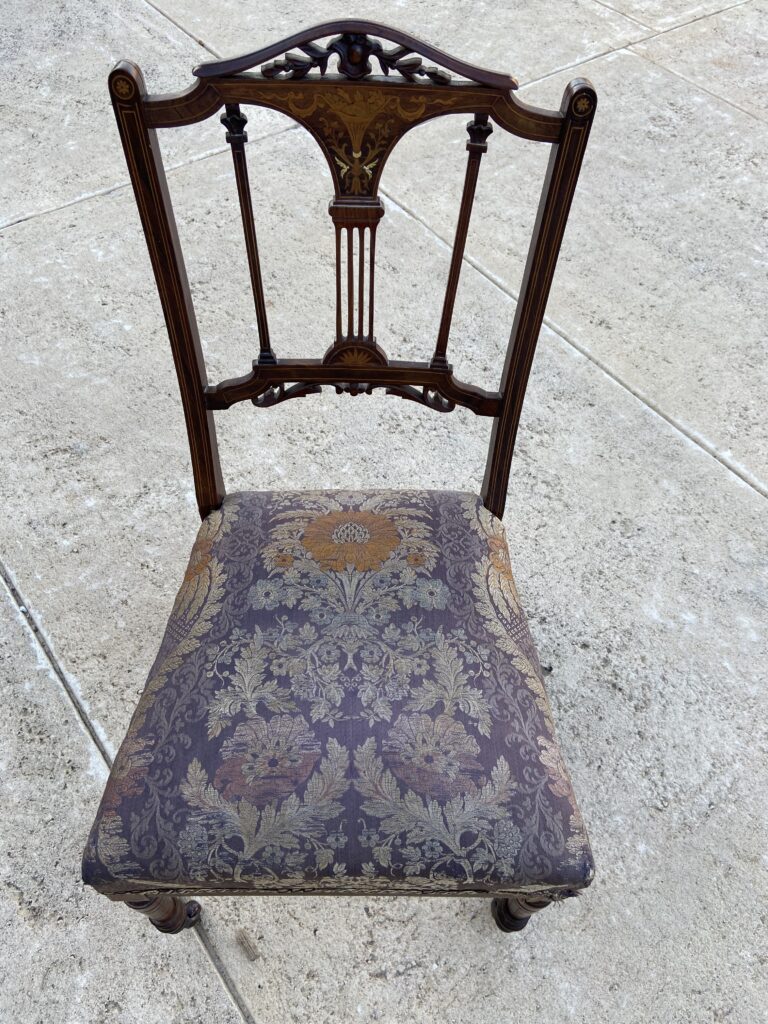 A Victorian Circa late 19th Century Solid Wood Hand Carved Nursing Chair
