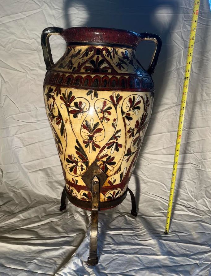 A Fine Quality Circa 1890 Italian Neoclassical Revival pottery urn, with sgraffito palmettes in pink, cream, and black, on an iron base. Handmade vase aprox size 30 inch tall