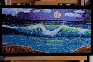“Silver Moon,” a captivating 20″x10″ acrylic on canvas by Ron Sanford, depicts a nocturnal seascape, where a luminous moon casts its silver glow over undulating waves. The pointillist technique creates a shimmering effect, as if moonlight is dancing on the water’s surface and the rugged coastline.