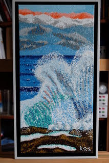 In “Boulder Backwash,” Ron Sanford masterfully employs pointillism to craft a kinetic seascape where frothy waves lash against steadfast boulders. The 10″x20″ acrylic work is a symphony of blues and whites, capturing the sea’s dance in myriad stippled hues, framed and signed, epitomizing nature’s dynamic forces.